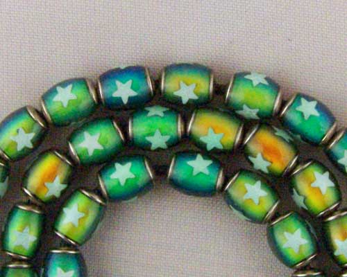 Mirage Bead 6x10mm with a "glow in the dark" star.